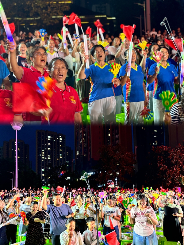 廣場上不同年齡層的市民手持小紅旗、巴巴掌等,在旋律中齊聲高歌,氣氛熱烈。張川 攝.jpg